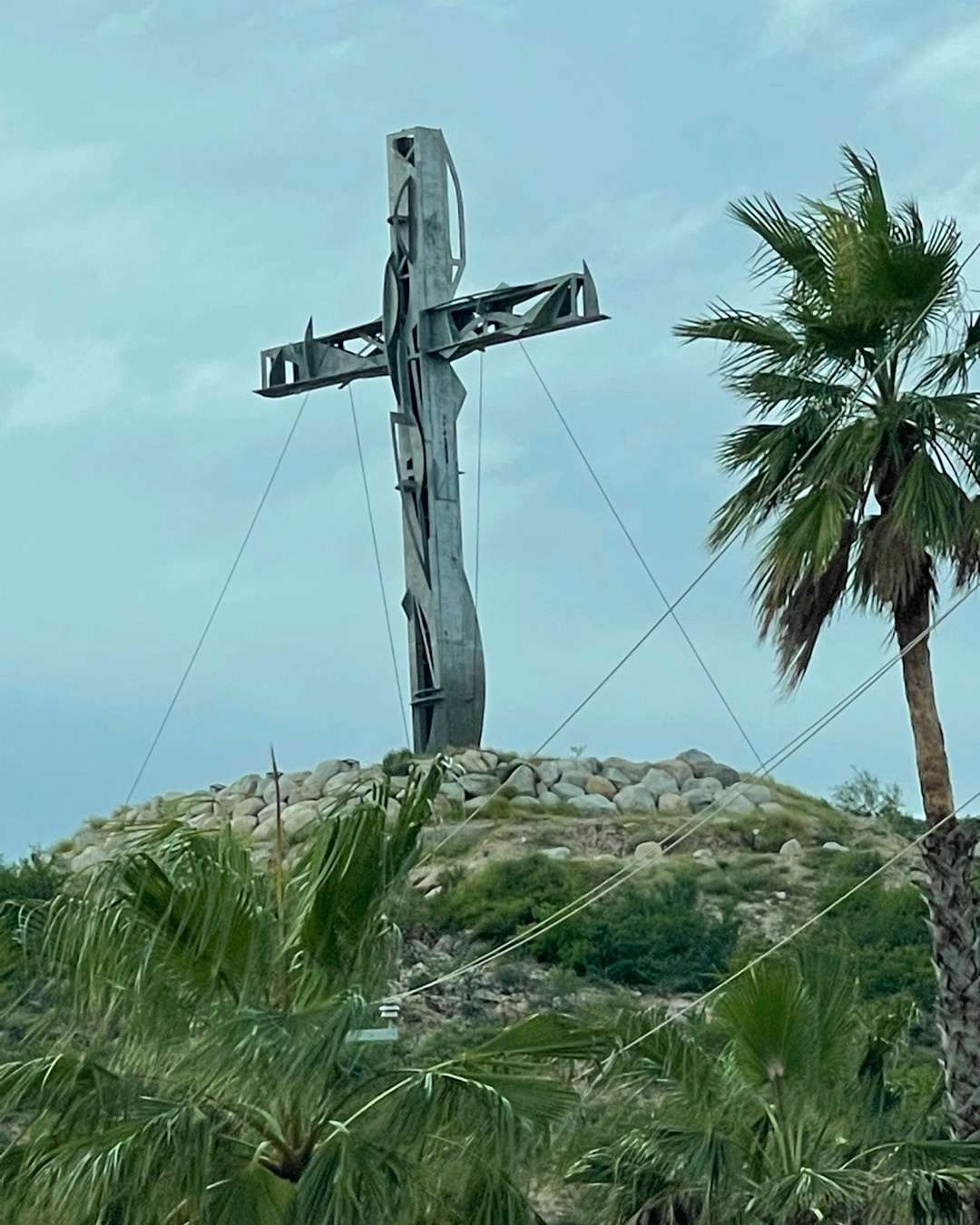 Safe driving to Cabo Cross made from old steel on top of a mountain